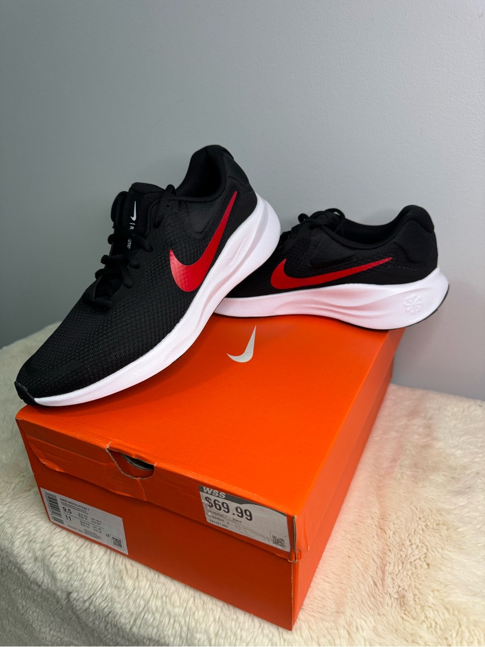 Nike Revolution Men’s Black Running Shoe with Red Swoosh